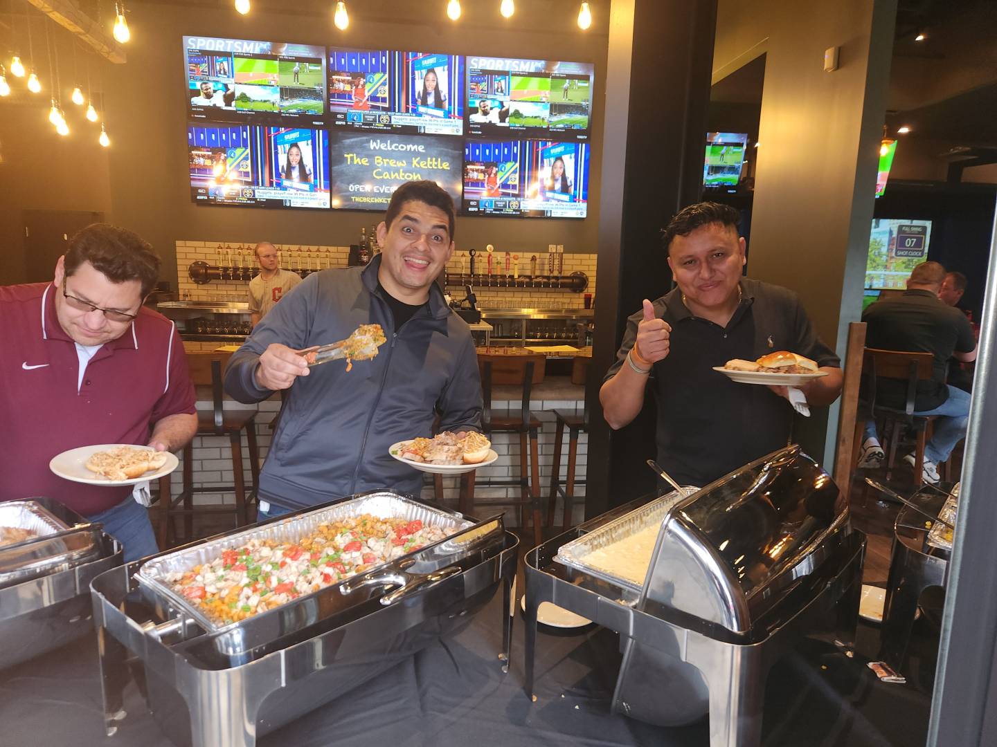 Team members in line for food