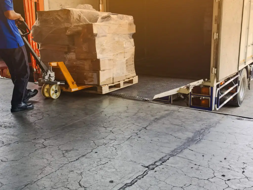 Two palletized loads in adjacent racking bays showing how inconsistent unit load height reduces warehouse storage density and cubic utilization.