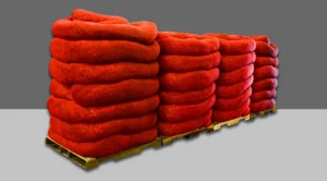 Stacks of red CORE erosion control services filter socks in a warehouse, approved for use in Millwood's Tennessee location