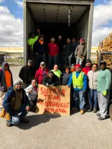 A group photo of millwood team at Smyrna Tennessee working on helping Nashville community after a natural disaster