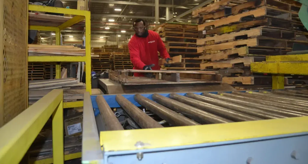 A picture of a a millwood team recycling pallets