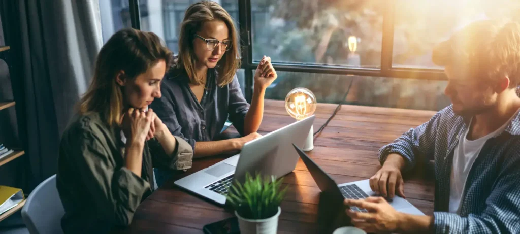 A photo of a group of young bussines people working together on a new project