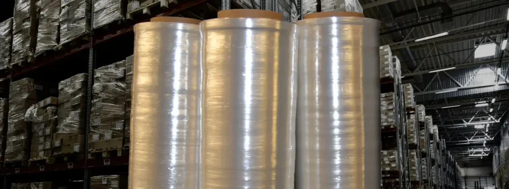 Three rolls of Millwood's Machine Stretch Film in a warehouse.