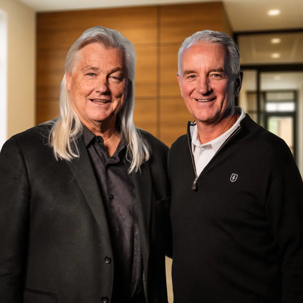 Chip and Steve standing together in an office setting