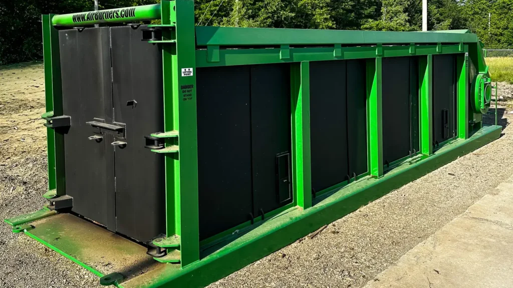 The Air Burner. A furnace machine that uses a high velocity curtain of air to block and trap smoke for a cleaner, more controlled burn, providing a sustainable way to reduce wood waste.