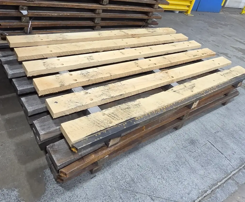 Repaired steel-reinforced pallet staged for return to an aerospace manufacturing facility.
