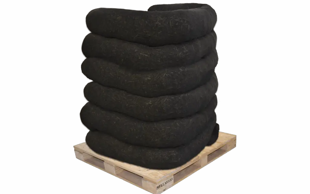 A CORE filter sock stacked on a pallet.
