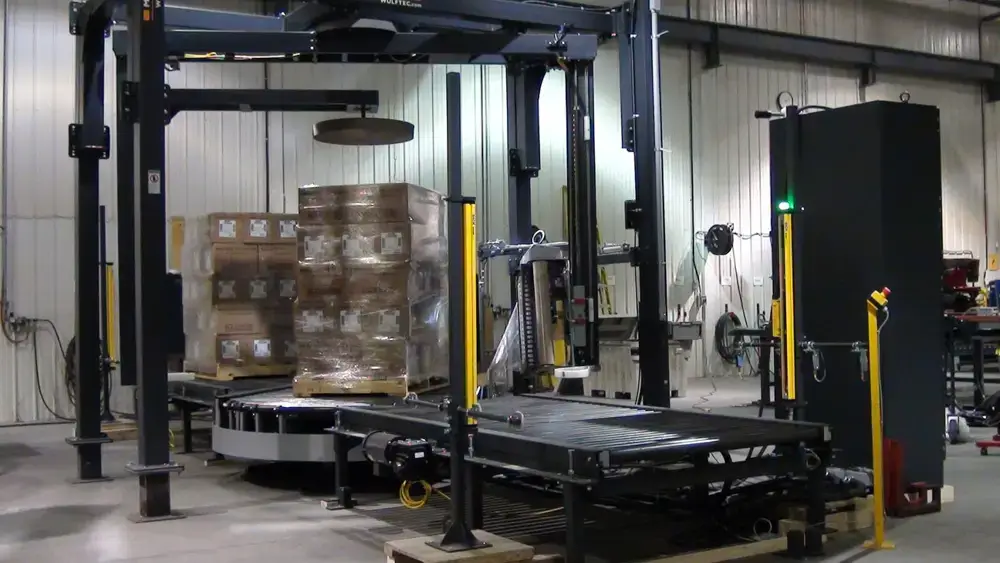 A WCAT-450 002 Robotic Stretch Wrapper produced by Robopac to automate packaging