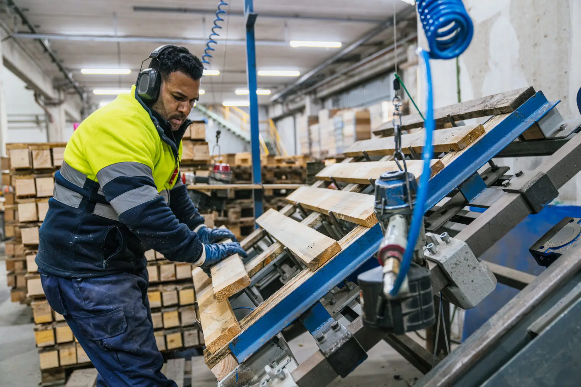 Used pallets being sorted for reuse through a vendor managed inventory program and pallet recycling program to reduce landfill waste.