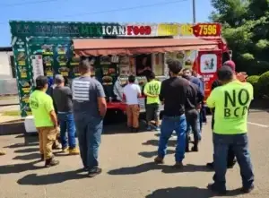 Millwood team members line up to eat at a food truck