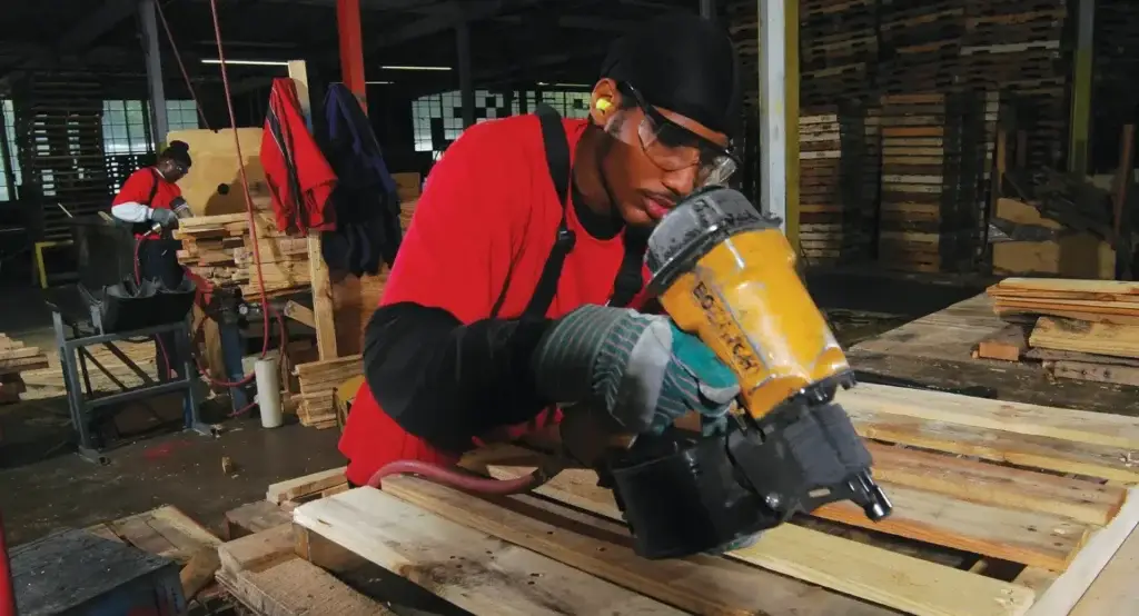 Custom pallets being redesigned for durability and reuse through a repair and return program to reduce waste.