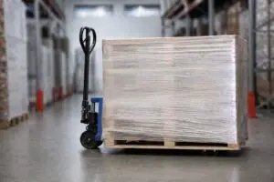 Palletized unit load secured with stretch wrap in a warehouse environment