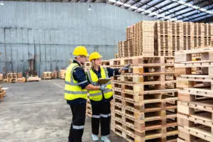Different pallet types supporting packaged unit loads in a warehouse and packaging testing environment.