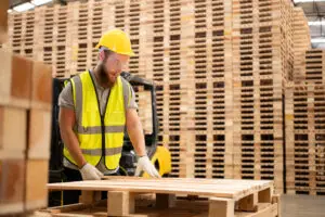 Wood pallets supporting sustainable supply chain operations in a modern distribution environment.