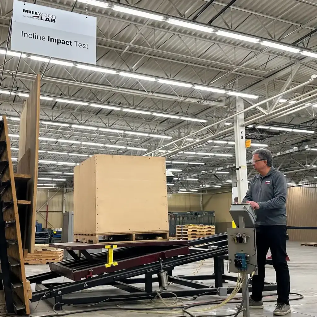 Wood pallet under incline impact testing in Millwood's ISTA-certified Packaging Science Lab