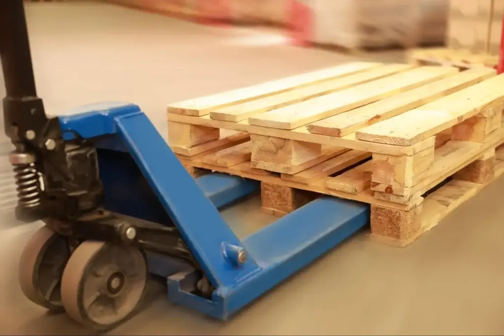 Close-up of wood pallet construction showing deck board spacing stringer dimensions and entry notching.