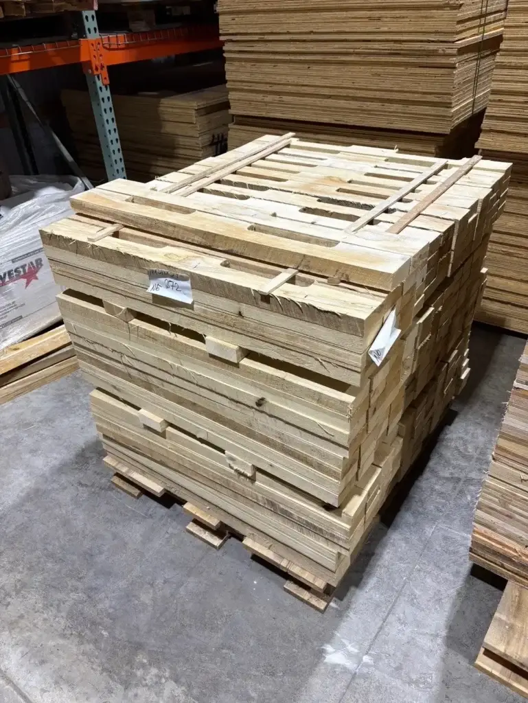 Millwood lumber components prior to pallet assembly, illustrating how actual lumber dimensions determine fit and structural performance in industrial wood pallet packaging programs that depend on consistent dimensional accuracy.